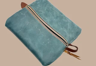 Leather or embroidery product image leather teal toiletry bag top view
