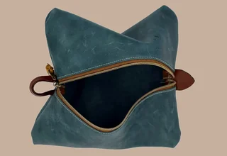 Leather or embroidery product image leather teal toiletry bag pucker